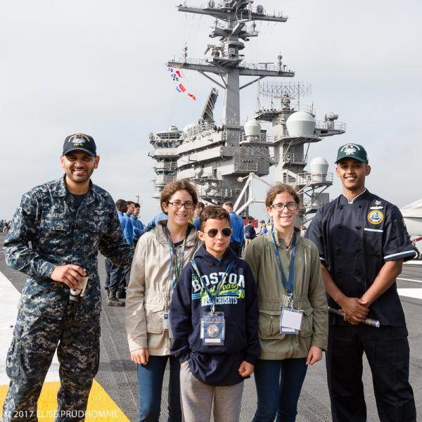Sailor Castro and Captain's Cook Bagna with Angela and Alessandra Sciarratta and Vittorio Sciarratta (alias Top Gun) - standing on the Flight Deck of the USS Theodore Roosevelt (CVN-71).