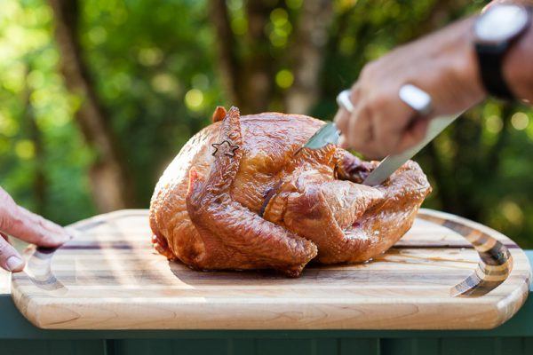Carving a Smoked Turkey cooked on a Weber Kettle barbecue served with our 2016 vintage Three Feathers Pinot Noir.